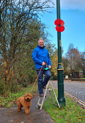 Andrew Luxton, putting up poppies for Remembrance Weekend 2022