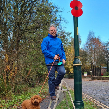 Andrew Luxton, putting up poppies for Remembrance Weekend 2022